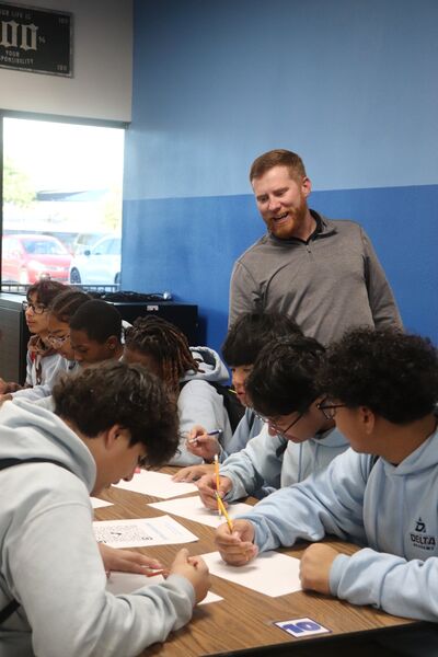 Mentor working with students in classroom
